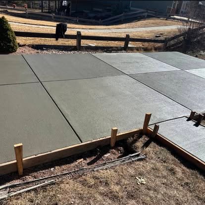 New concrete pad installation — large slab with precision forming and smooth trowel finish